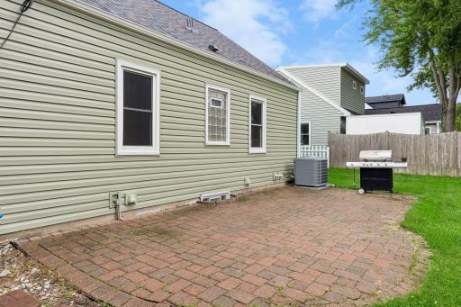 Whether hosting summer barbecues or enjoying your morning coffee, the brick patio creates an inviting outdoor living space with easy access to the home and plenty of room for outdoor furniture.