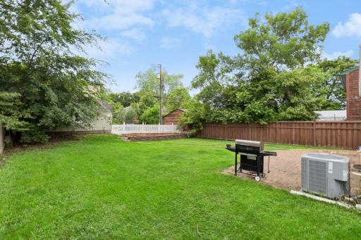 The generous backyard offers endless possibilities for recreation, gardening, or relaxing in your own outdoor retreat.