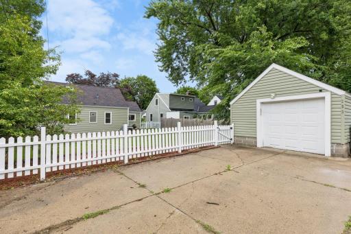 Completing the property is a detached garage offering secure parking and additional storage. The long driveway provides extra off-street parking, while the fenced backyard adds convenience and privacy.