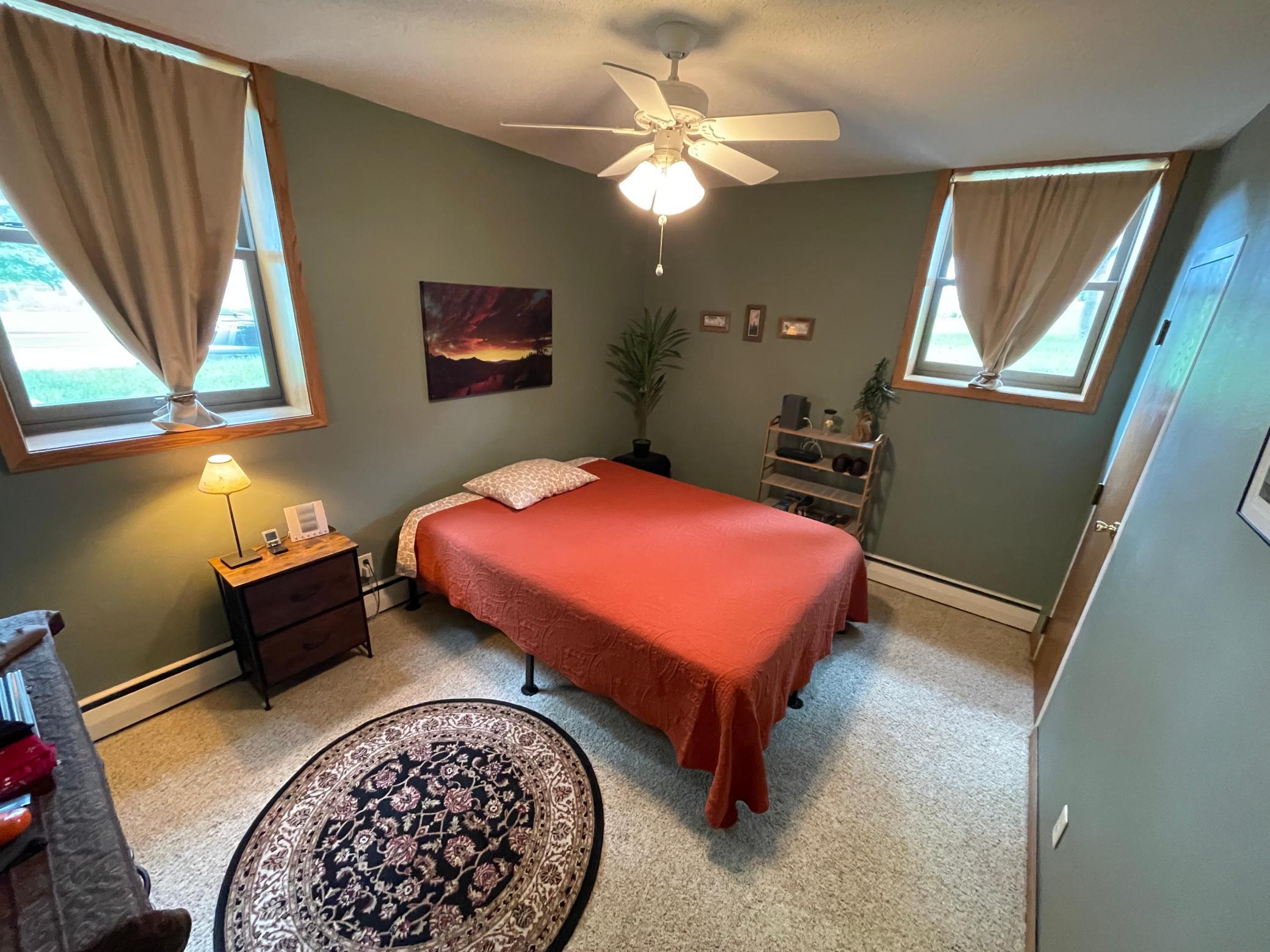 Large bedroom with wonderful windows on east and south walls!