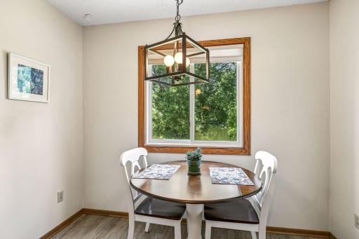 Eat in kitchen area with window overlooking private yard.