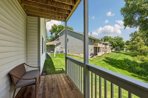 Newly refinished deck overlooking private backyard.