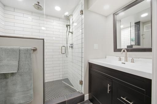 Downstairs Bathroom with a fully tiled shower