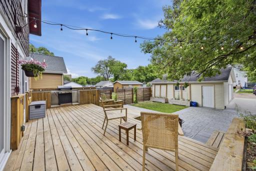 Amazing Backyard Deck with lights, built in planters, and grill area