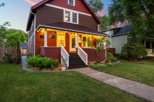 Inviting front porch at twilight. This is truly an unexpectedly exceptional home, with the perfect blend of timeless character and modern convenience