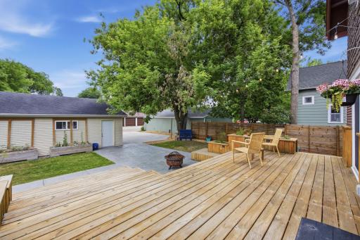 Amazing Backyard Deck with lights, built in planters, and grill area