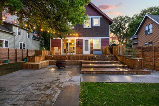 Welcome home with a perfect back yard deck and stamped concrete patio