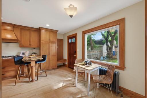 Sun-filled breakfast nook overlooking the backyard and mature landscaping. 7