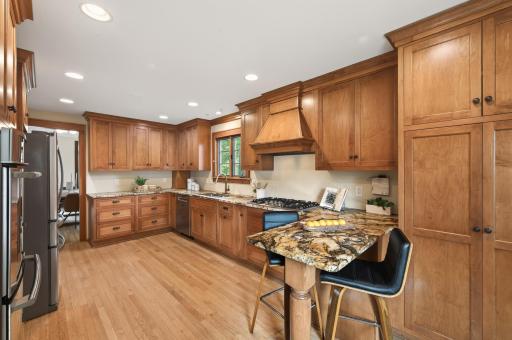 Thoughtfully updated kitchen featuring custom cabinetry, granite countertops, and premium finishes.
