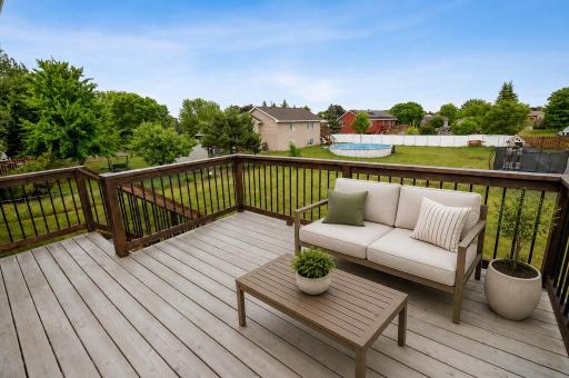 Deck overlooks the fenced yard. *photo digitally staged*