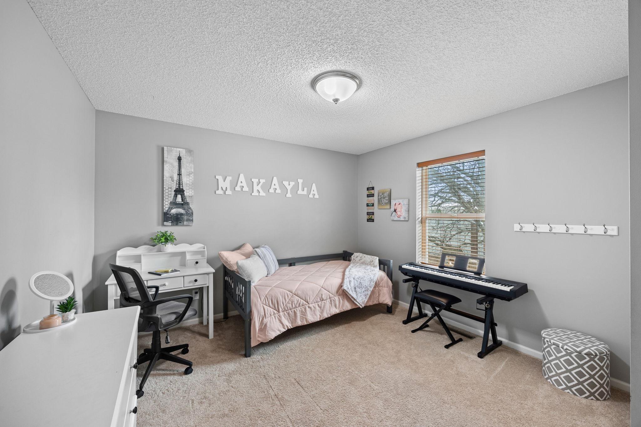 Offering plenty of natural light, comfortable carpeting, and closet storage.