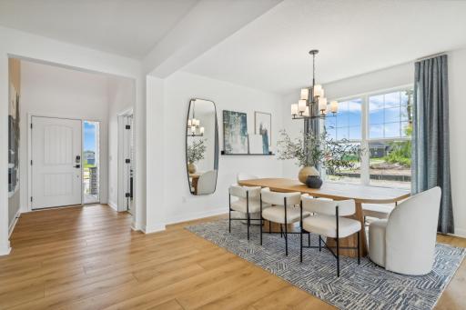 (Photo of model home, finishes will vary) Fit for casual weekend brunches and upscale celebrations alike, the formal dining space joins seamlessly with the Great Room for additional entertaining options.