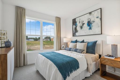 (Photo of model home, finishes will vary) Located on the first floor, this bedroom can accommodate overnight guests or visiting family members. It is adjacent to a bathroom for easy convenience.