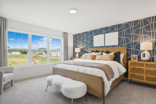 (Photo of model home, finishes will vary) The owner’s suite is a lavish haven on the top floor, hosting a large bedroom, en-suite bathroom and walk-in closet.
