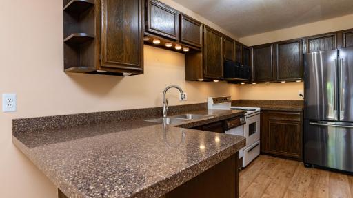 Plenty of counter work space and under cabinet lighting.