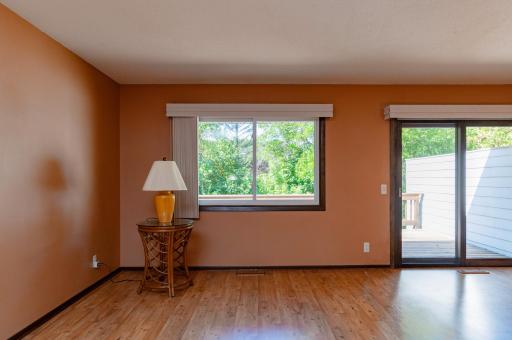 Large living/dining are with laminate flooring throughout the main level.