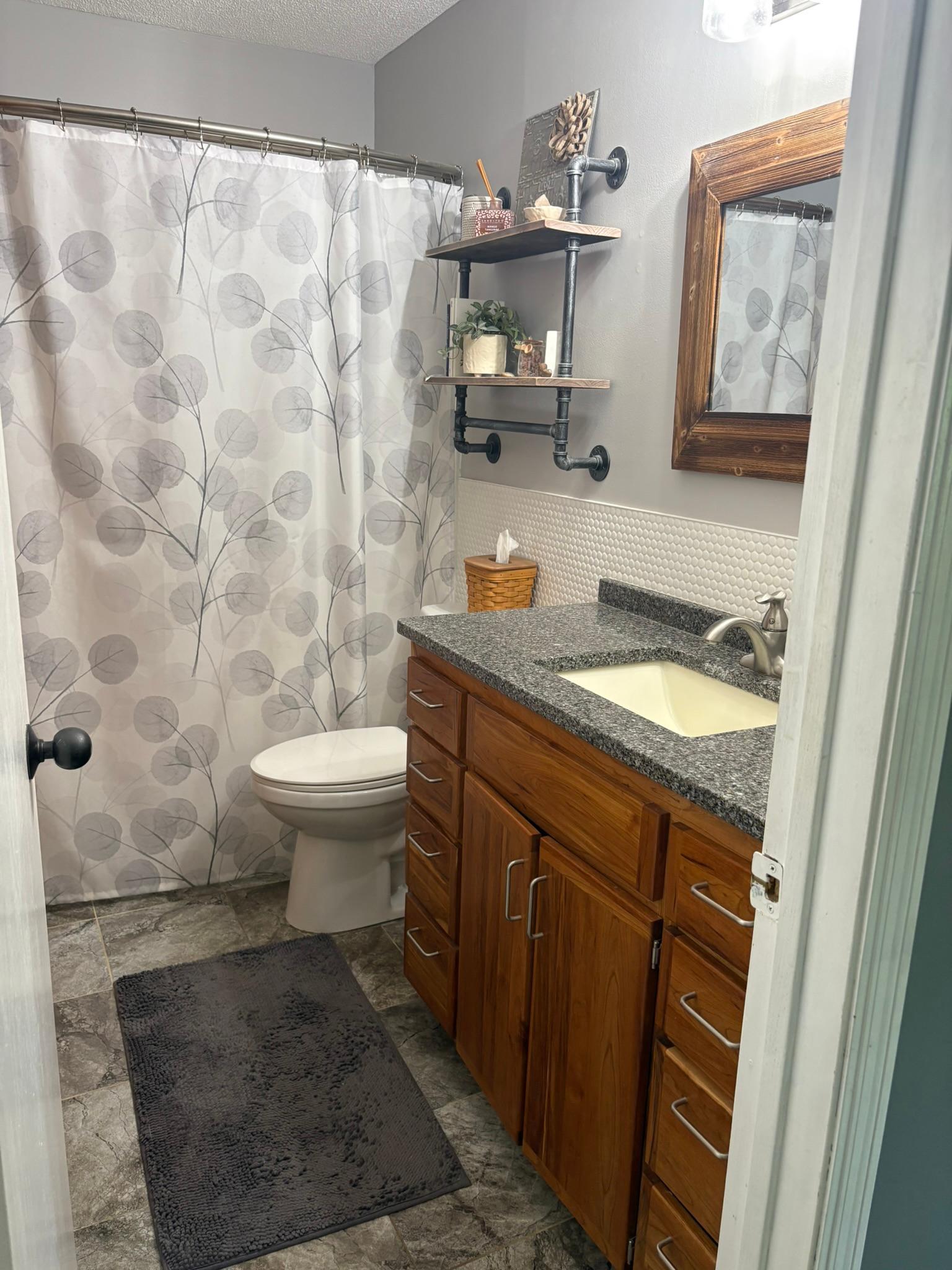 Main Floor Bathroom with cherry cabinets