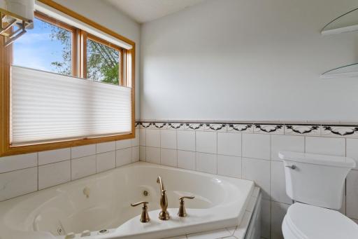 Master bath with separate tub/shower and california closets