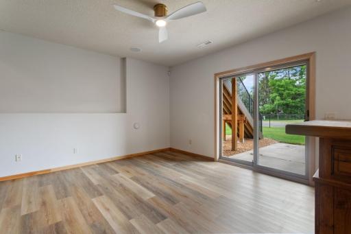 Walkout lower level leads to patio area and fenced in backyard