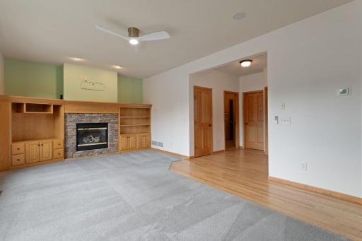 Living room with gas fireplace and more built in cabinets