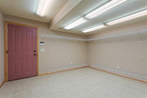Lower level entry/mud room from heated 4 stall/shop