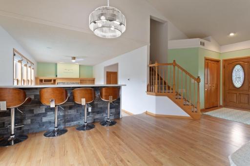 Dinette with snack ledge, open stairs leads to upper level bedrooms