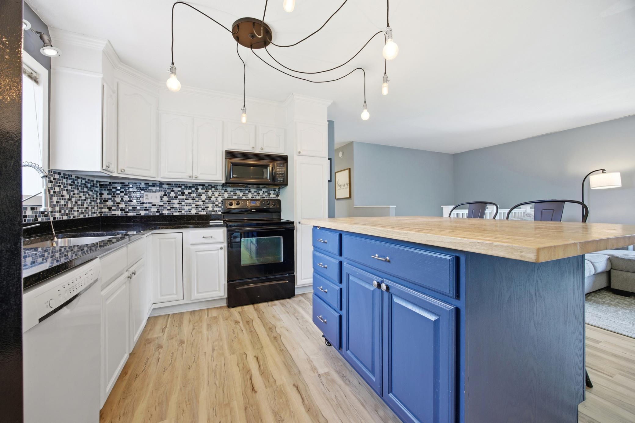 Tile backsplash and updated lighting