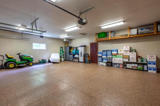 Over sized insulated and heated 3 stall garage with epoxy floors,