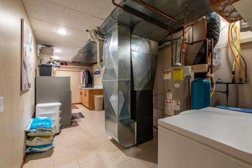 Large laundry mechanical room is finished and has additional very large storage closet