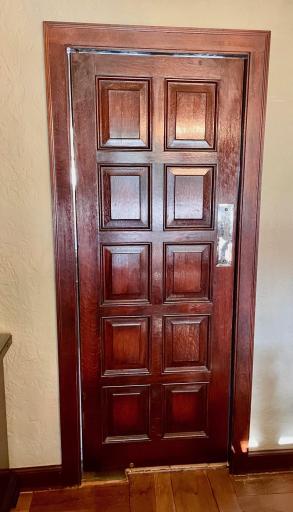 Swinging door between dining room and kitchen
