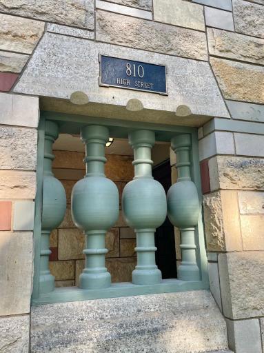 Original address plaque, stone accent and decorative spindles