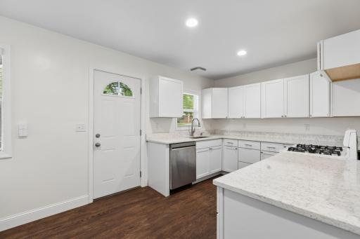 The remodeled eat-in kitchen is sure to impress, featuring stylish cabinetry, new countertops & appliances.