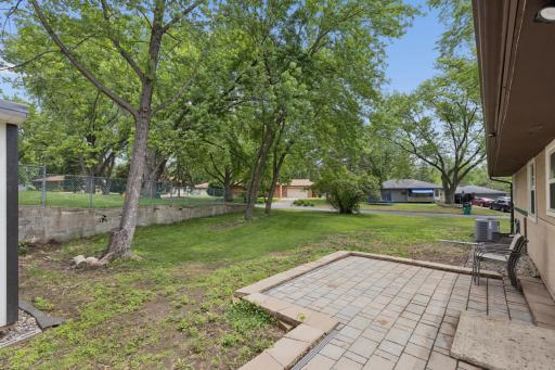 Additional highlights include newer windows, patio, shed, an oversized two-car garage, a large driveway with ample off-street parking, and a convenient location close to shopping, dining, parks, and major freeway access.