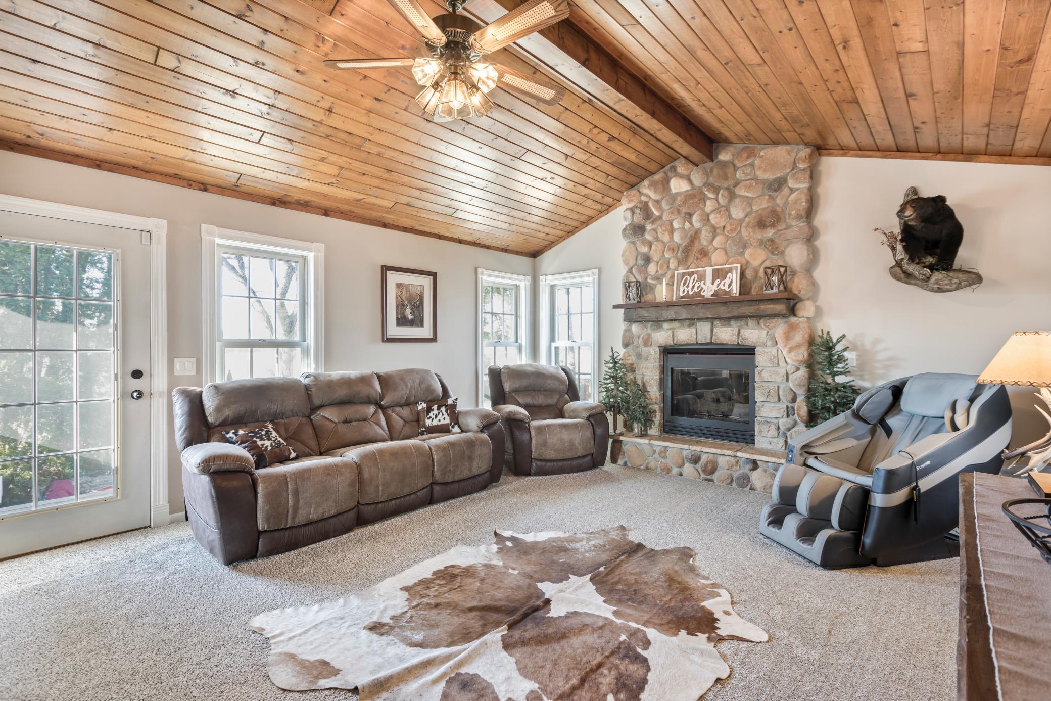 Beautiful fireplace and tongue and groove vaulted ceiling
