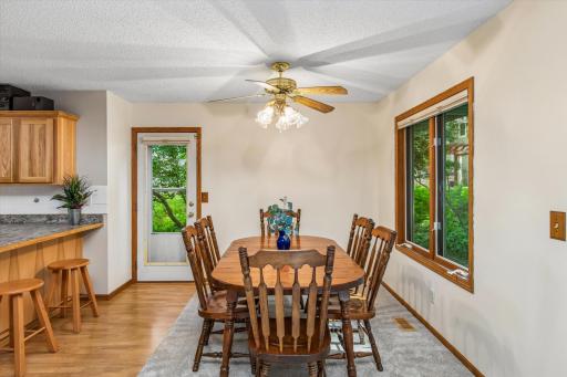Dining room with access to deck and view of backyard