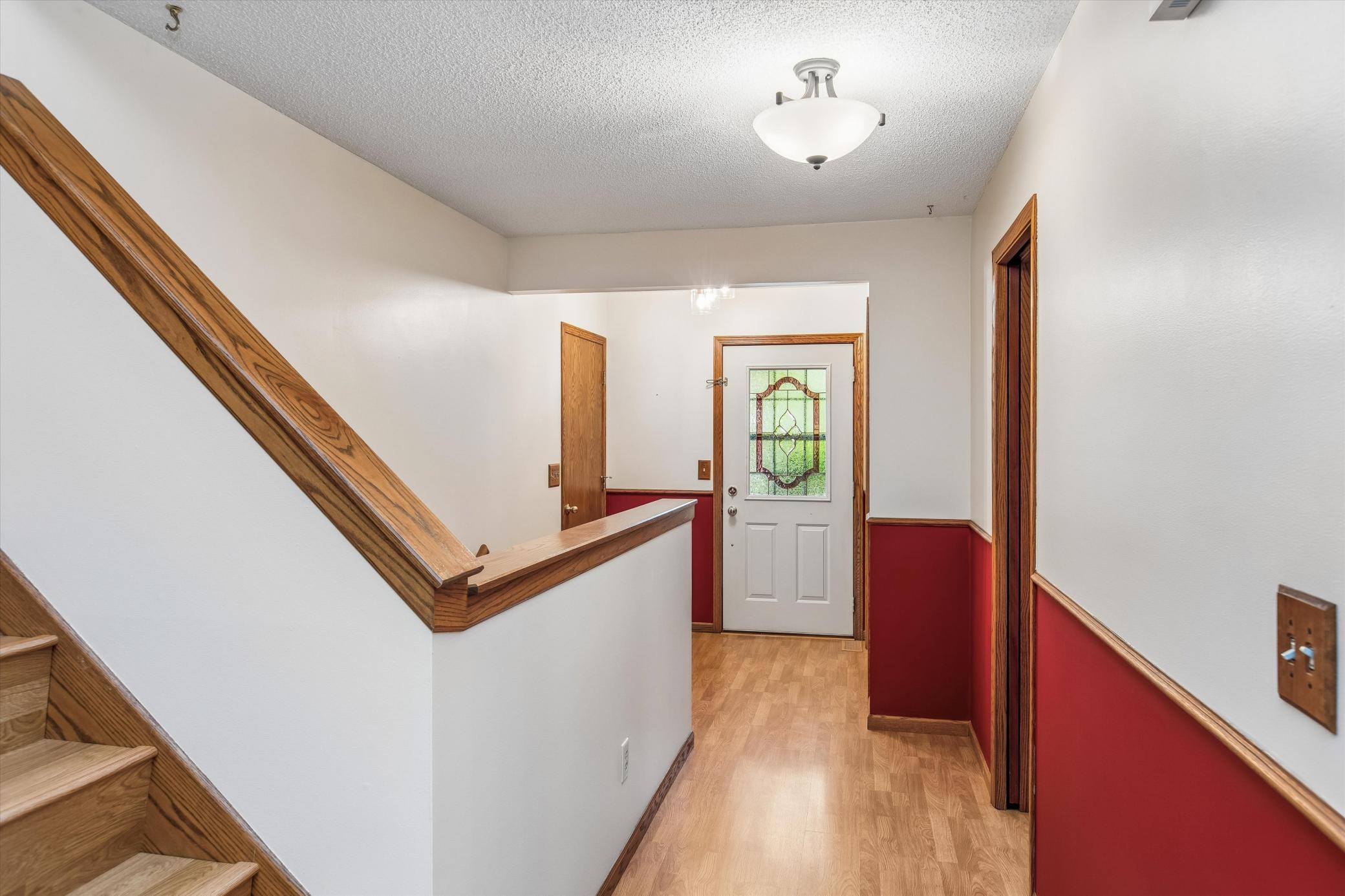 Nice foyer with closet and access to laundry room/garage door.