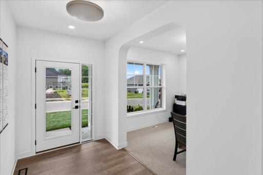 Welcoming foyer opens to a flex room for your office or extra gathering spaces.