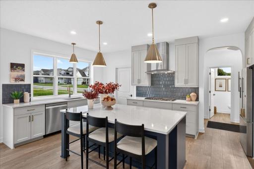Stunning kitchen with built in convection microwave/wall oven, gas cook top, eat in kitchen with large working space at the island and a walk-in pantry.