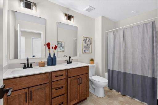 Full bath with dual vanities makes it easier to get out of the house on time