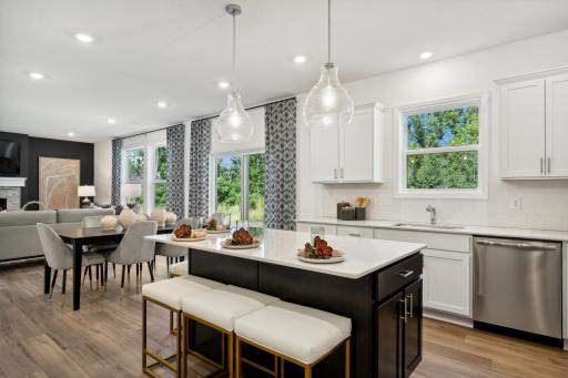 The kitchen has ease-of-access to the mudroom and flows seamlessly into the dining room