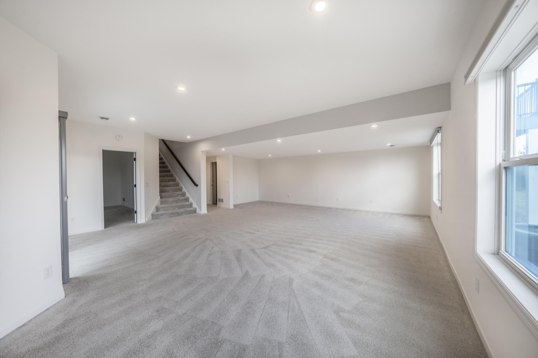 Enormous lower level family / game / bonus room also with tall ceilings and recessed lighting!