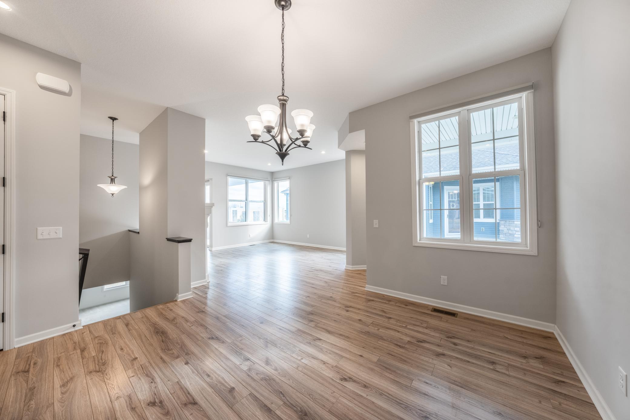 Bright open concept floor plan looking through dining room into living room. Gorgeous!