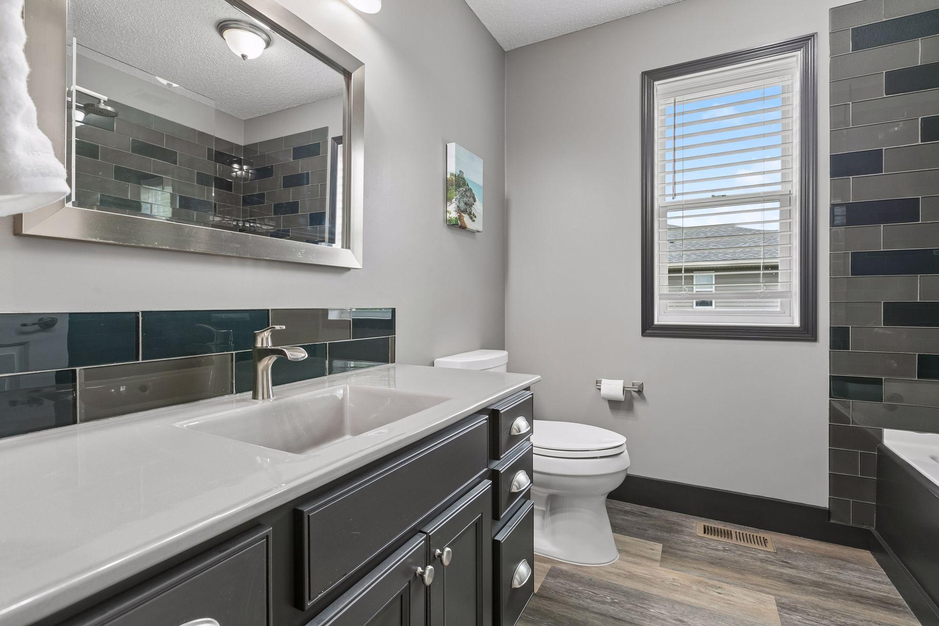 Full guest bathroom on the upper level, with new faucets and showerhead 2026.