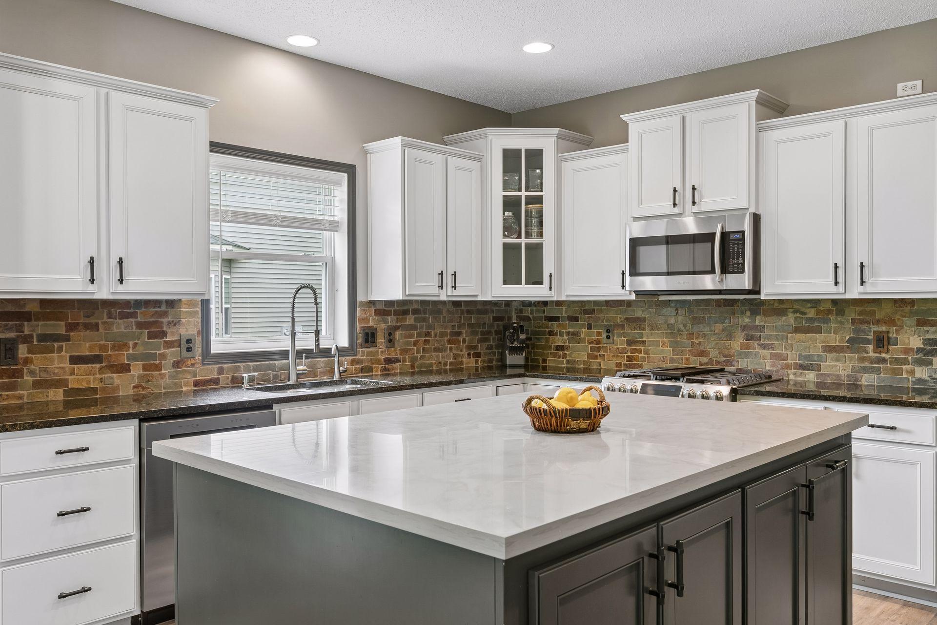 A delight to prepare meals together in this luxurious space. Bonus storage in the center island, space atop the cabinets for your personalized decor.