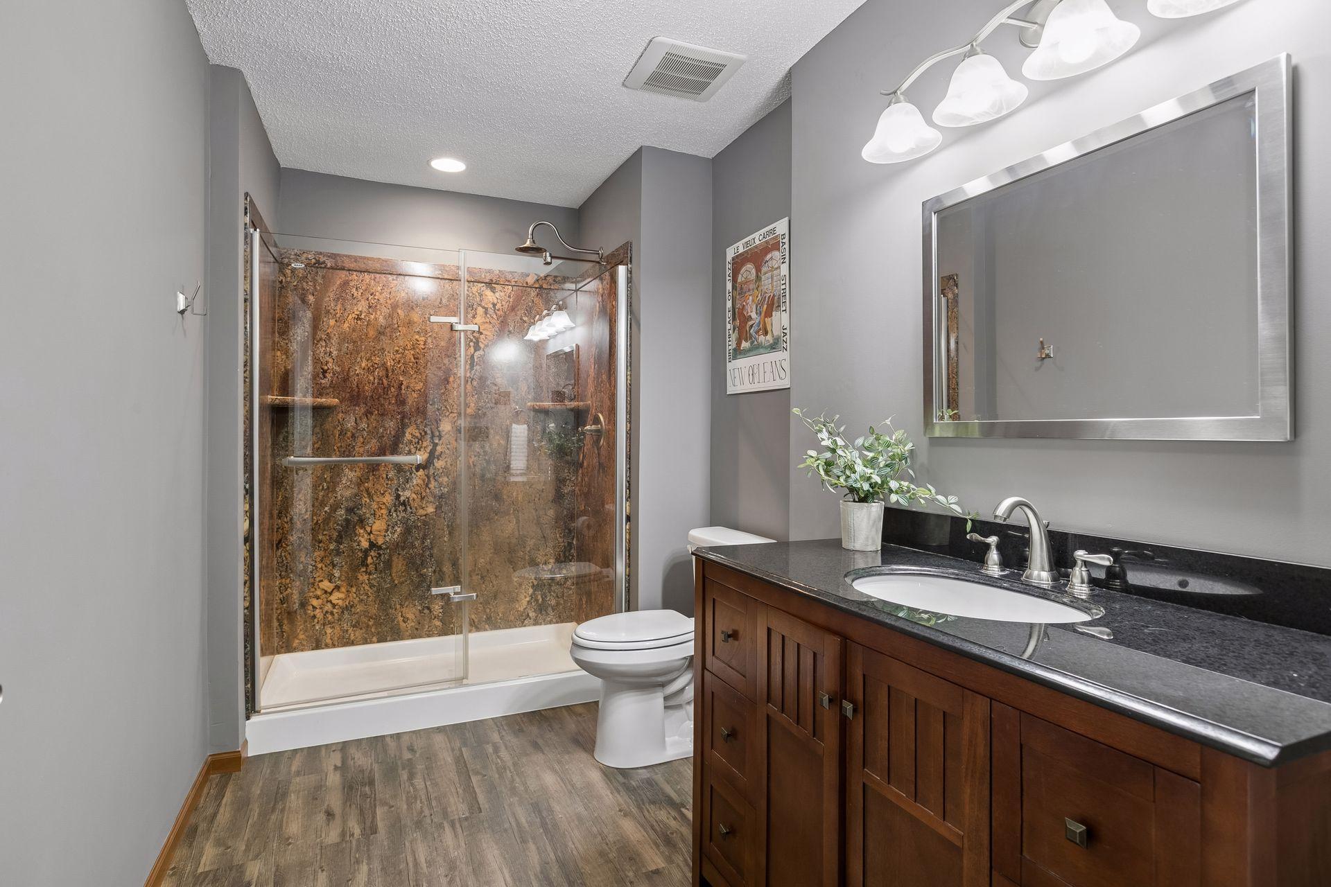 3/4 bathroom on lower level with modern fixtures, added in 2015.