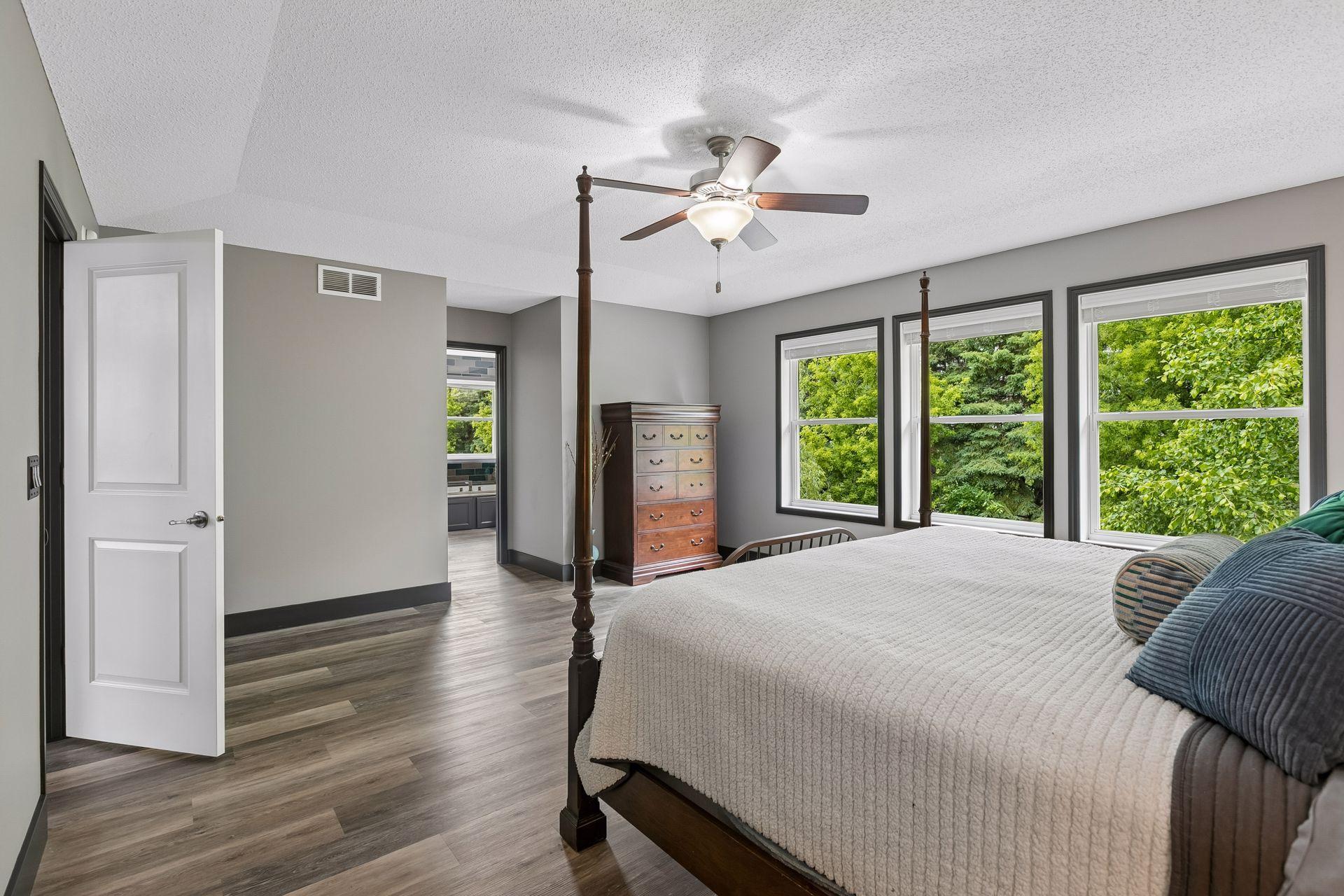 Upstairs primary suite with treed privacy and ensuite bath.