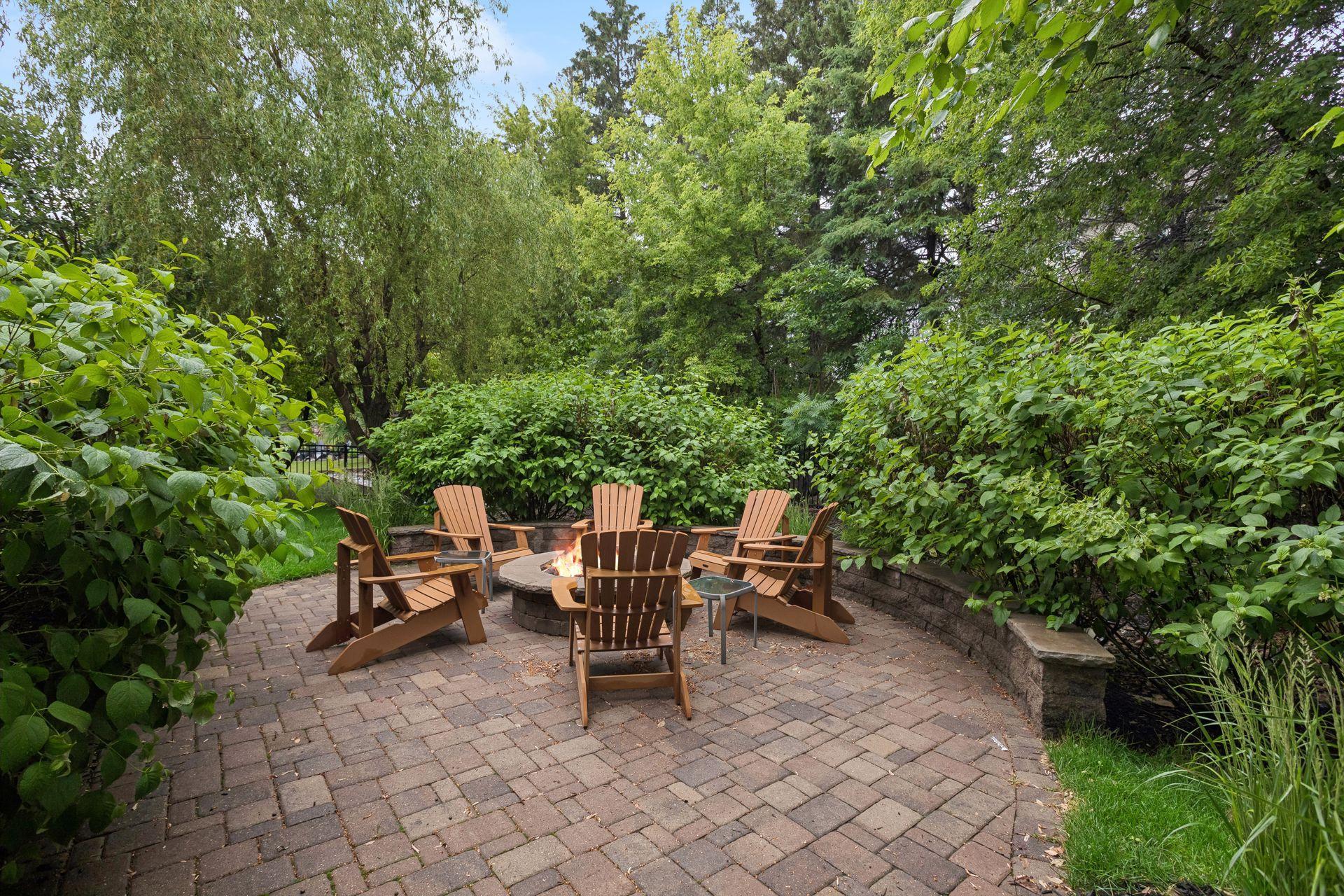 Backyard paver patio landscaped in 2017 with firepit plumbed to natural gas line.