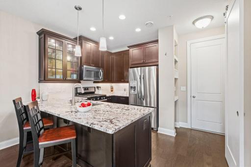 Gourmet Kitchen w/ granite counters, SS apps (inc gas range), under-mount sink, gorgeous wood cabinetry, subway tile backsplash & pantry
