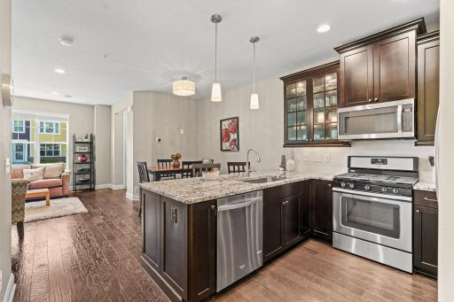 Gourmet Kitchen w/ granite counters, SS apps (inc gas range), under-mount sink, gorgeous wood cabinetry, subway tile backsplash & pantry