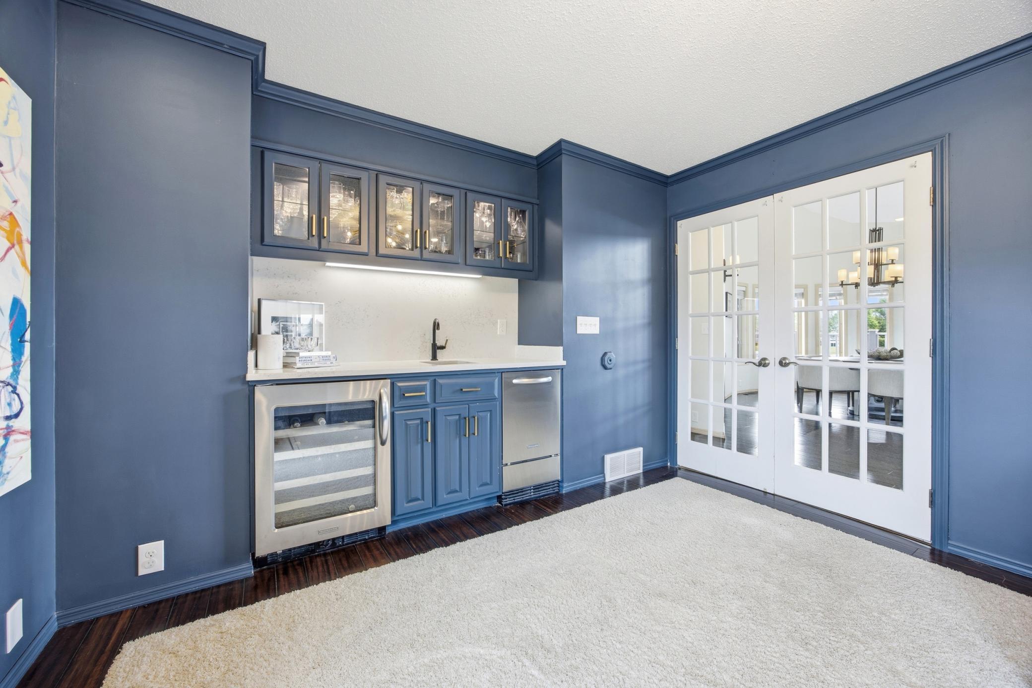 Main Floor Den w/ Wet Bar & French Doors